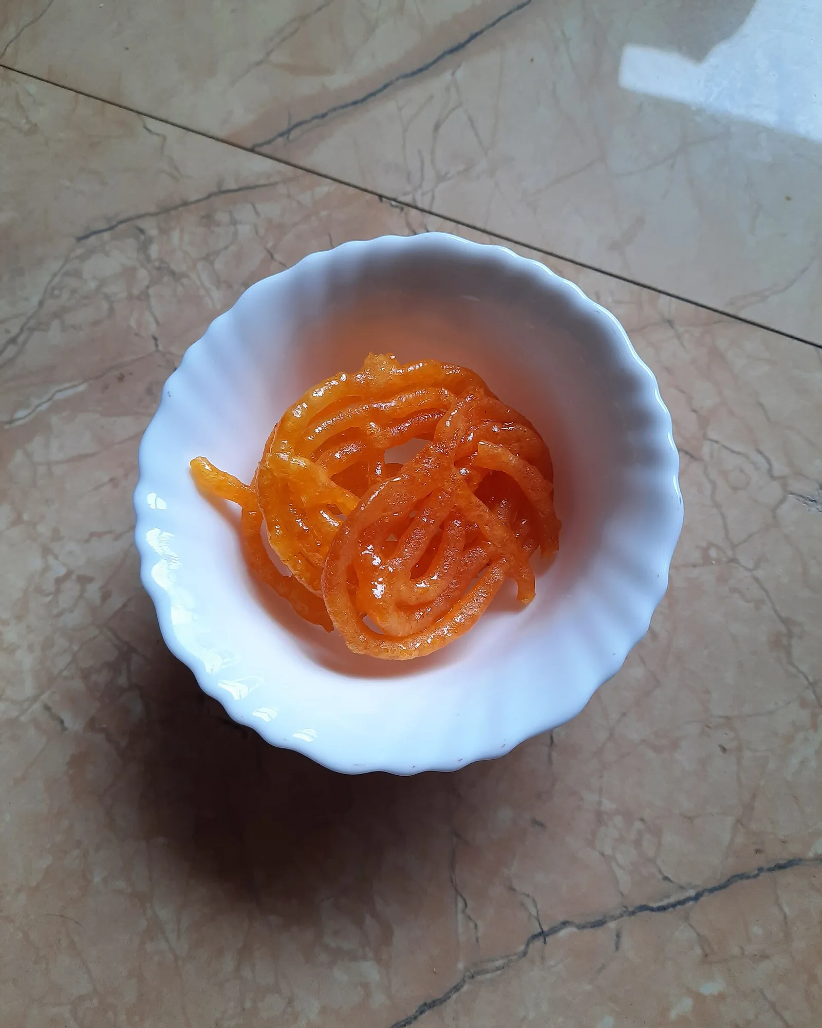 Bowl of fresh saffron-orange jalebi, a favourite Nagercoil sweet