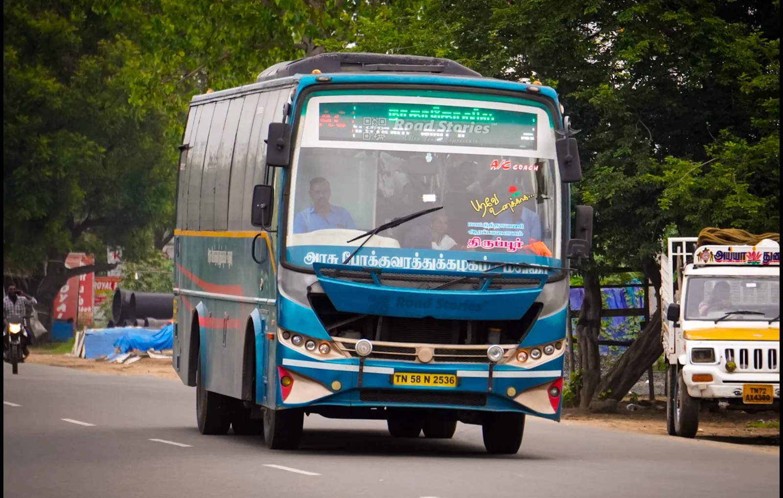 A blue TNSTC Madurai air-conditioned bus on the Tirupur to Nagercoil route