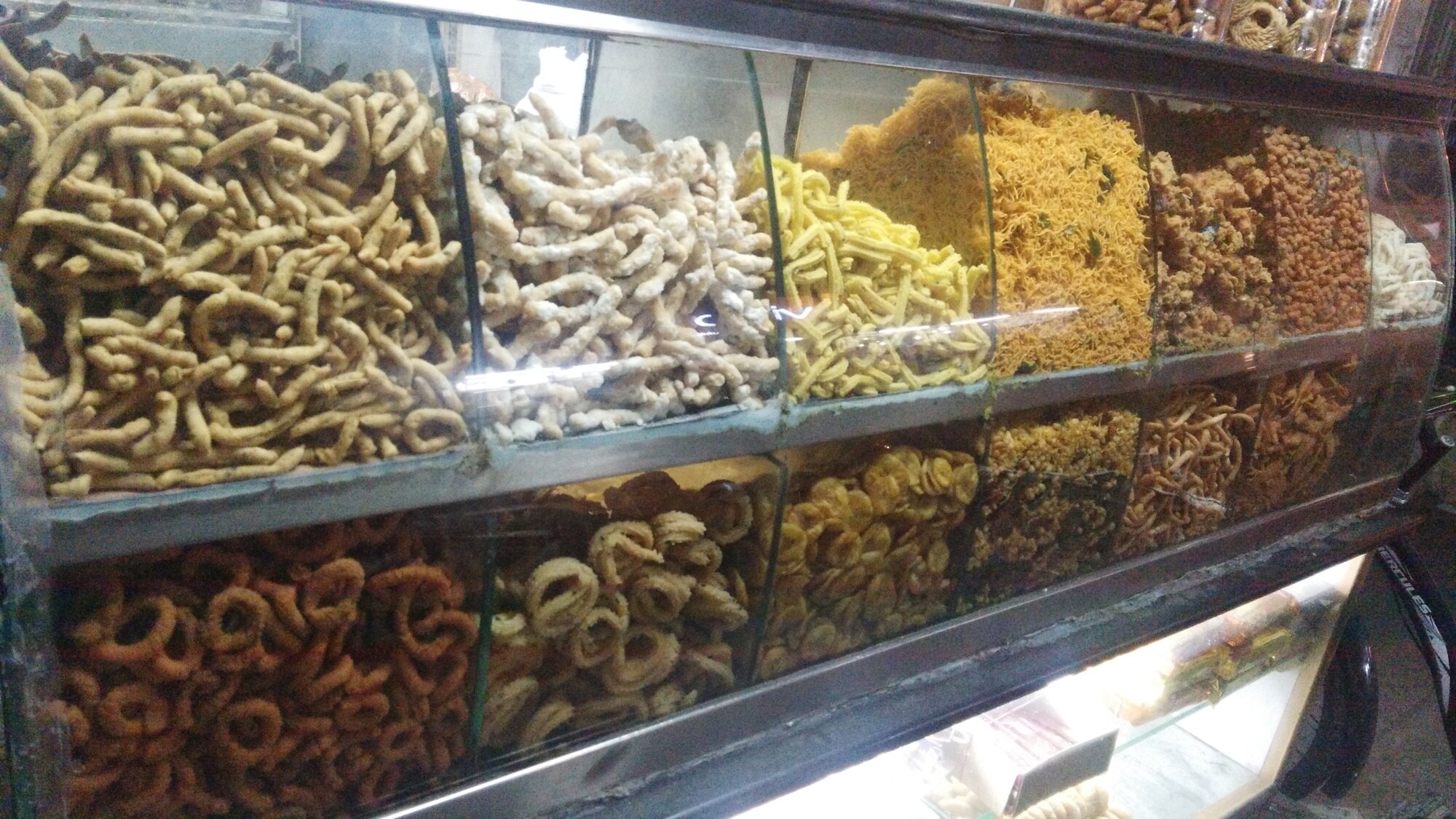 Showcase full of fresh traditional snacks in Vadasery